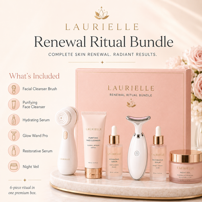 Laurielle Renewal Ritual Bundle skincare set displayed on a marble tray with its pink gift box. The set includes a facial cleanser brush, purifying face cleanser tube, hydrating serum dropper bottle, glow wand pro, restorative serum dropper bottle, and night gel jar, with text detailing what is included on a soft beige background.